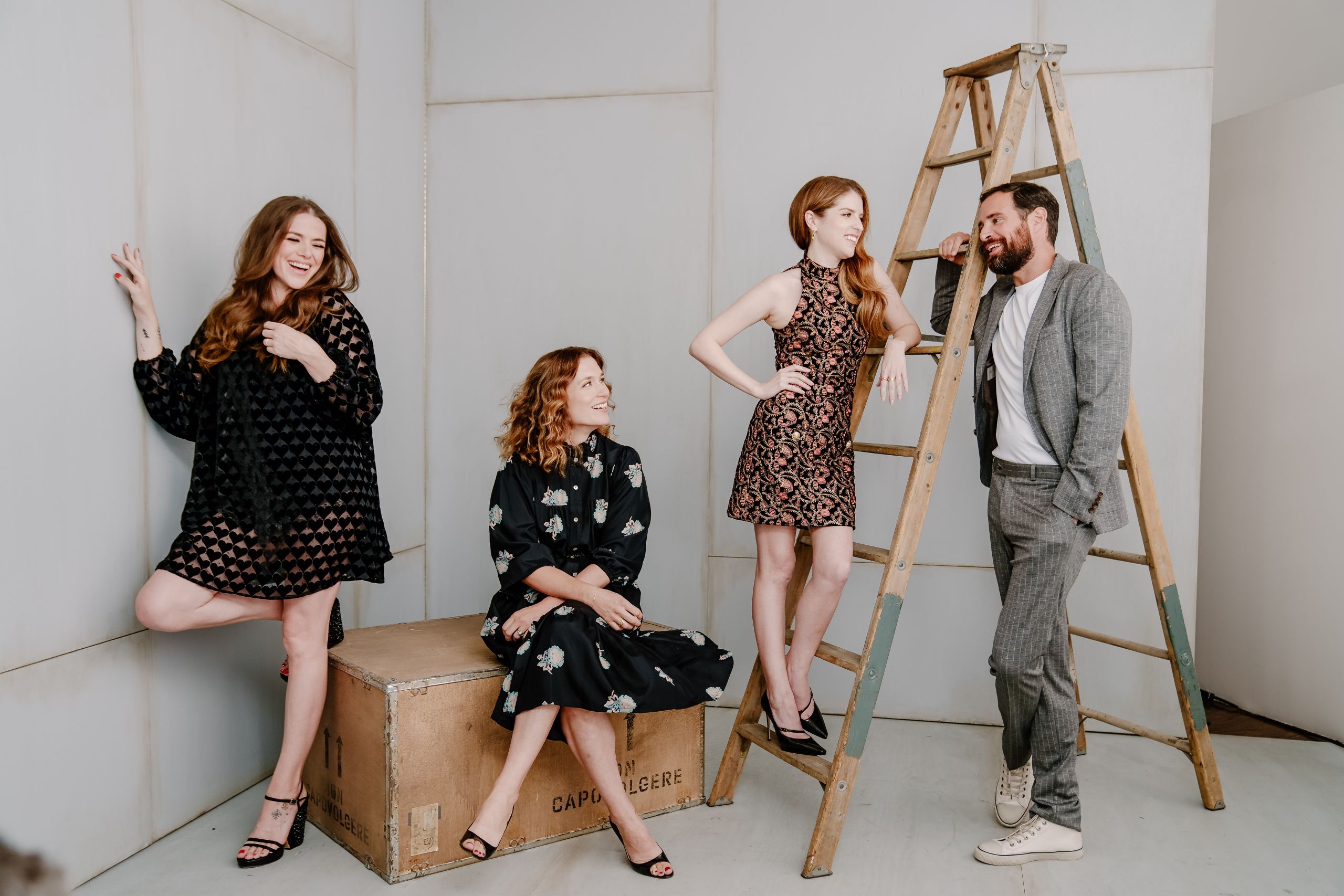 Celebrity portrait session with Anna Kendrick and cast members on a rustic studio set with wooden ladder and crates for film promotion captured by Origin Films Toronto event photography and photography services